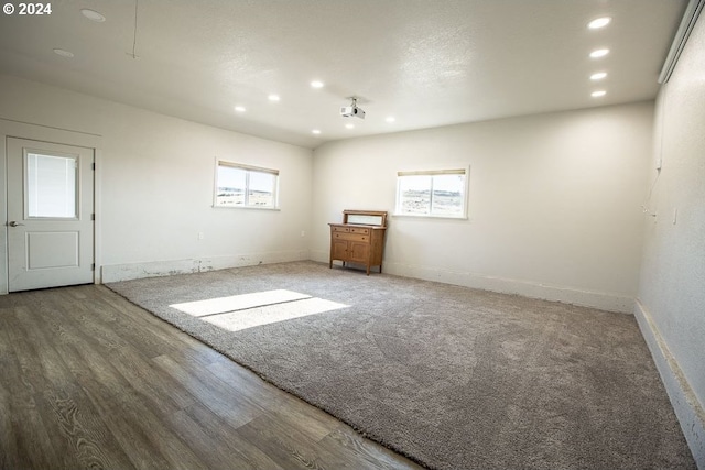 unfurnished room with wood-type flooring