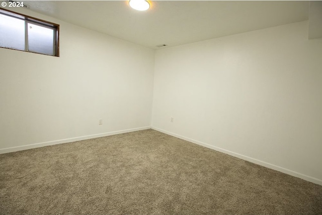 spare room featuring carpet flooring