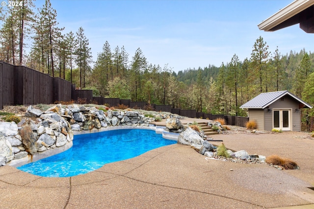 view of pool featuring an outdoor structure