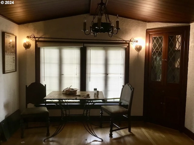 dining room featuring hardwood / wood-style flooring, wood ceiling, vaulted ceiling, and a notable chandelier