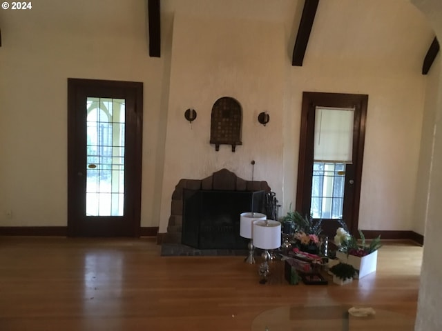 entrance foyer with hardwood / wood-style floors and a wealth of natural light