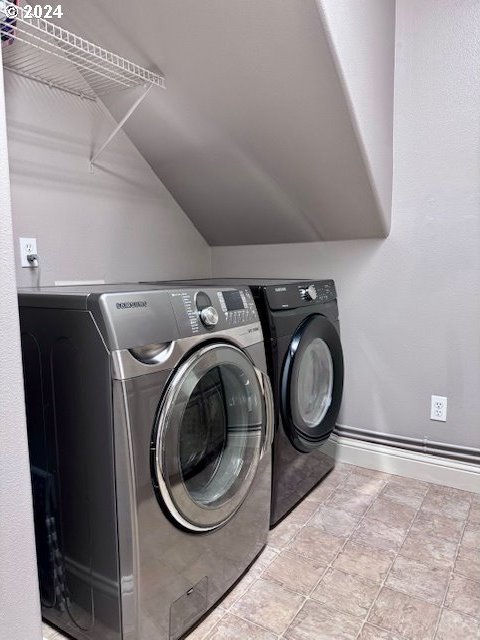 washroom featuring washer and dryer