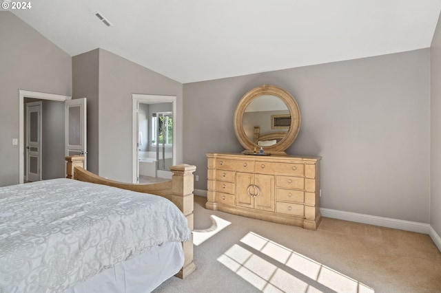 bedroom featuring lofted ceiling and light carpet