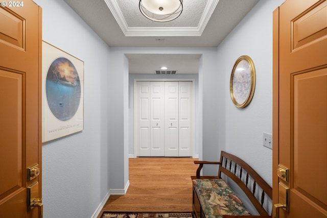 hallway featuring hardwood / wood-style flooring and a textured ceiling