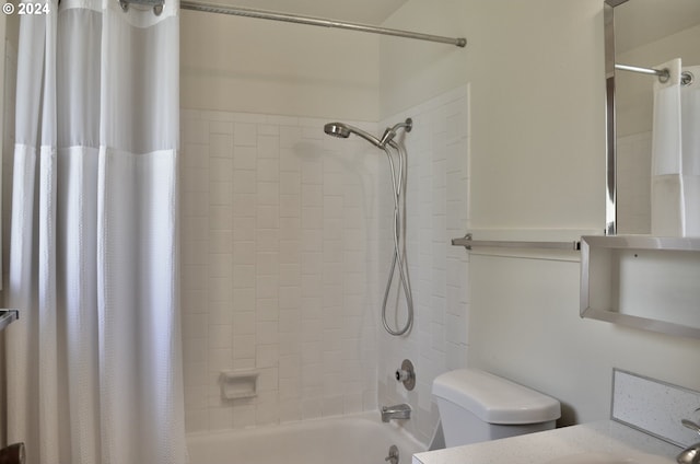 full bathroom with vanity, shower / bath combination with curtain, and toilet