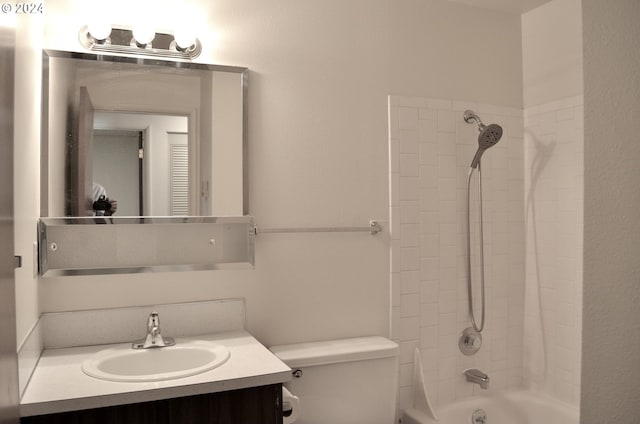 full bathroom featuring vanity, toilet, and tiled shower / bath