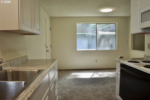 kitchen with white cabinets, light colored carpet, white appliances, and sink