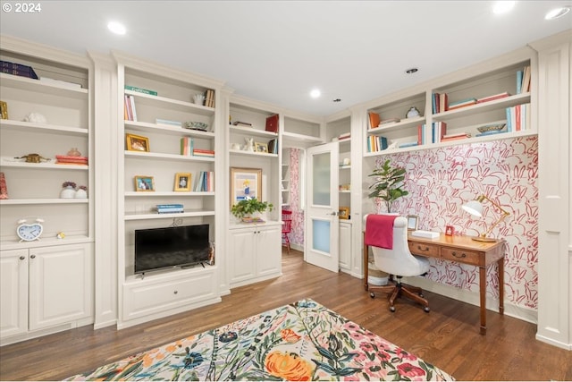 living area featuring dark hardwood / wood-style flooring and built in shelves