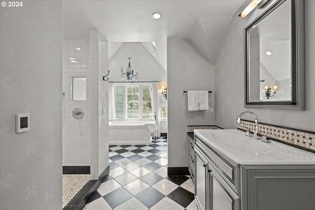 bathroom featuring plus walk in shower, tile floors, a chandelier, vaulted ceiling, and oversized vanity