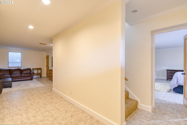 hall featuring crown molding and tile flooring