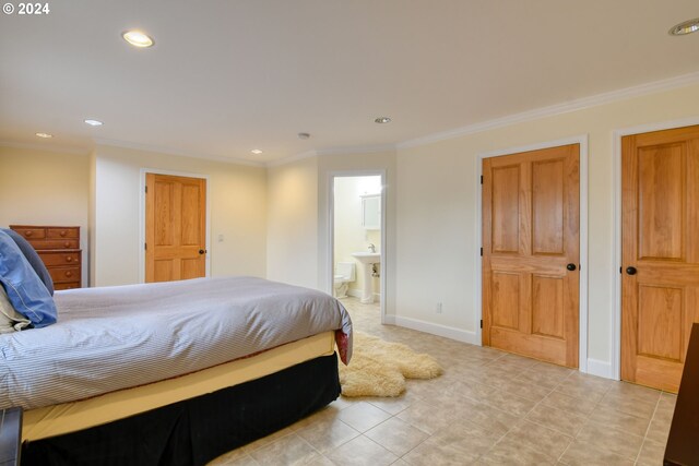 tiled bedroom featuring ensuite bathroom and crown molding