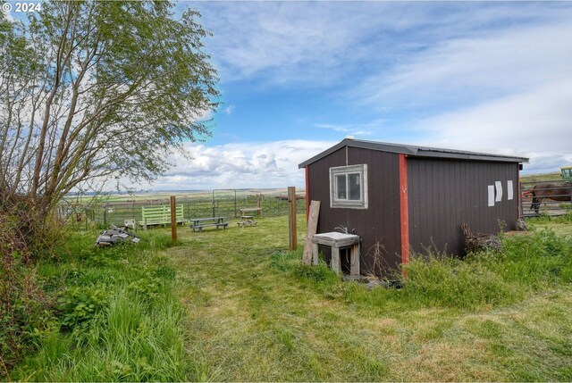 view of outdoor structure featuring a rural view