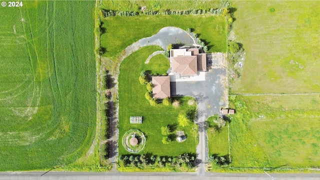 birds eye view of property with a rural view