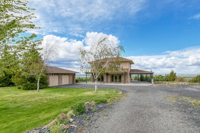 view of front of property with a carport and a front yard