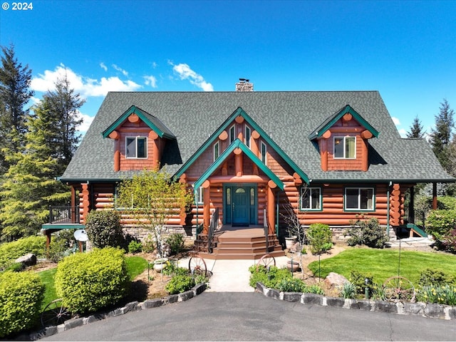 log home with a balcony