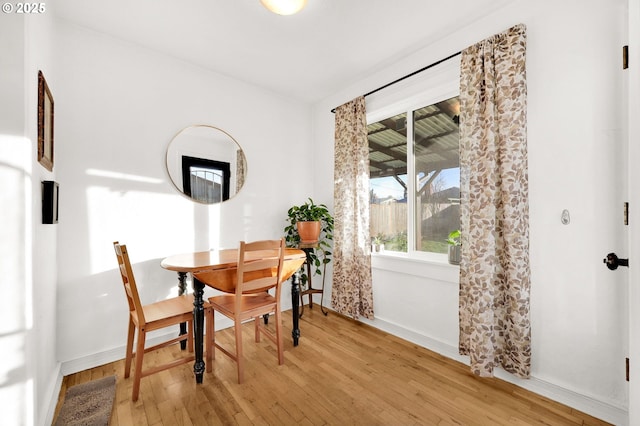 dining room with hardwood / wood-style flooring