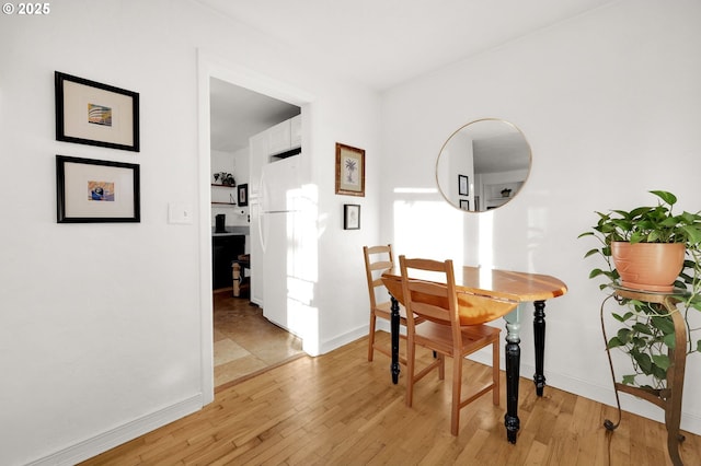 dining room with light hardwood / wood-style flooring