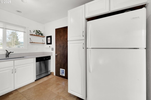 kitchen with white cabinetry, white refrigerator, dishwasher, and sink