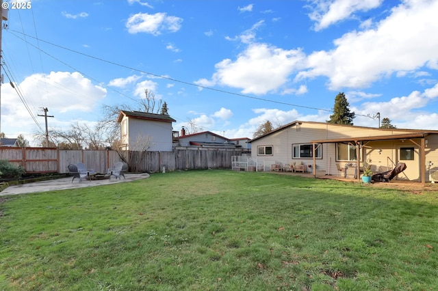 view of yard with a fire pit and a patio