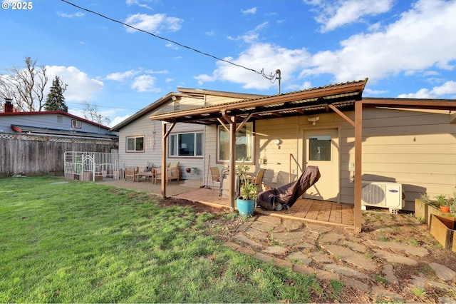 rear view of house with a lawn