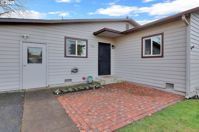 entrance to property with a patio area