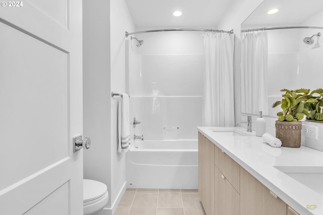 full bathroom featuring tile patterned flooring, toilet, vanity, and shower / tub combo with curtain