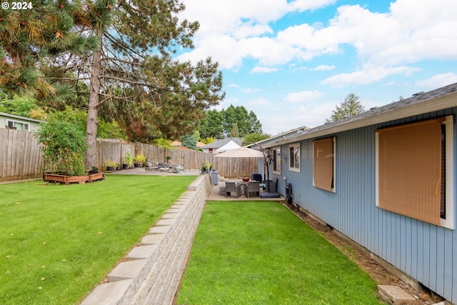 view of yard with outdoor lounge area and a patio