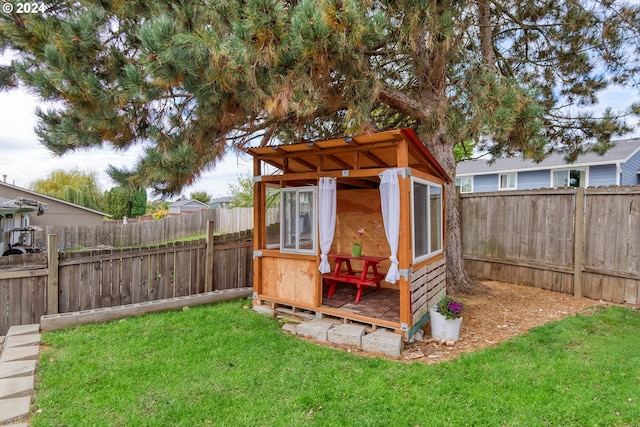 view of outdoor structure with a lawn