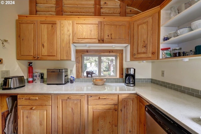 kitchen with light stone counters and stainless steel dishwasher