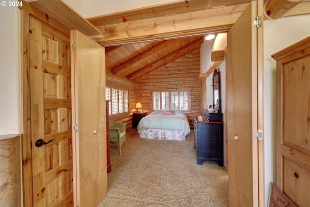 carpeted bedroom with vaulted ceiling with beams and wood ceiling