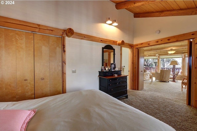 unfurnished bedroom with vaulted ceiling with beams, carpet floors, a closet, and wood ceiling