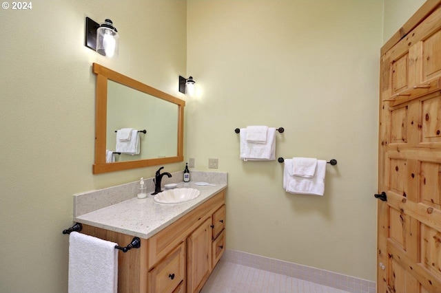 bathroom featuring tile patterned floors and vanity