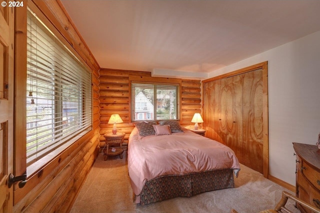 carpeted bedroom with a closet and rustic walls