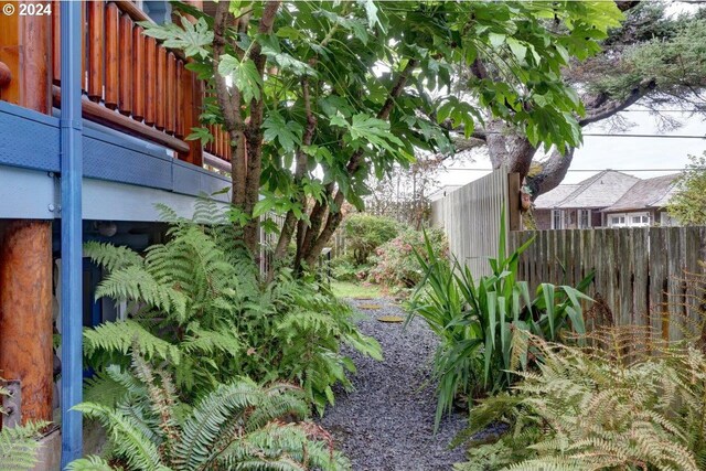 view of yard with a balcony