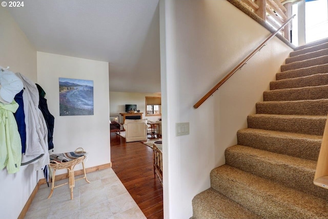 stairway featuring hardwood / wood-style floors