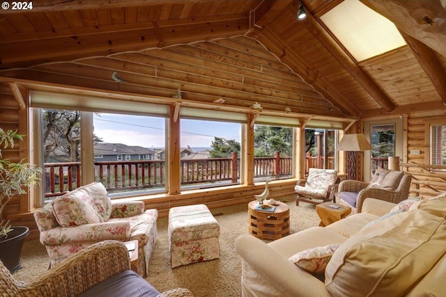 sunroom / solarium with vaulted ceiling with skylight, wooden ceiling, and a wealth of natural light