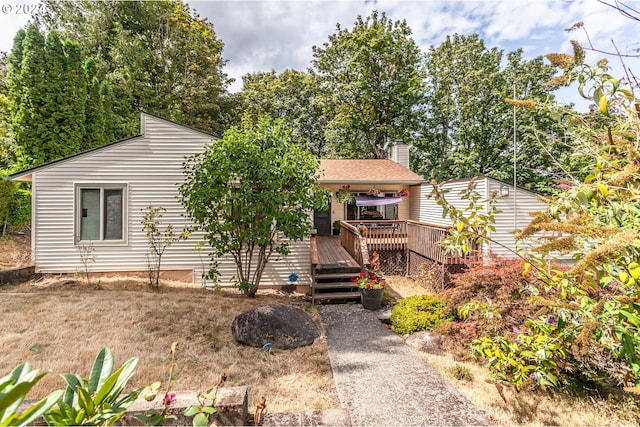 exterior space featuring a wooden deck