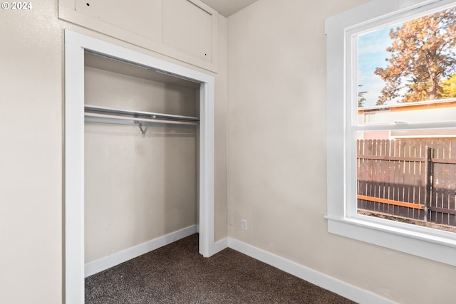 foyer with a textured ceiling and vaulted ceiling