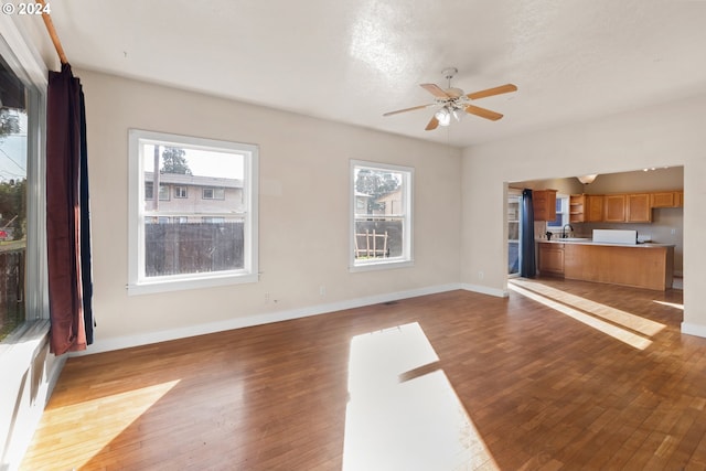 foyer featuring dark wood-type flooring and ceiling fan