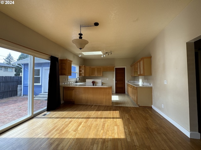 unfurnished living room featuring hardwood / wood-style floors, a textured ceiling, and ceiling fan