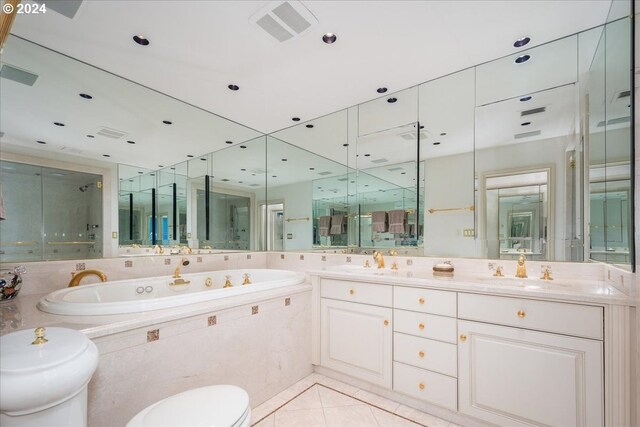 full bathroom with vanity, tile patterned flooring, toilet, and separate shower and tub