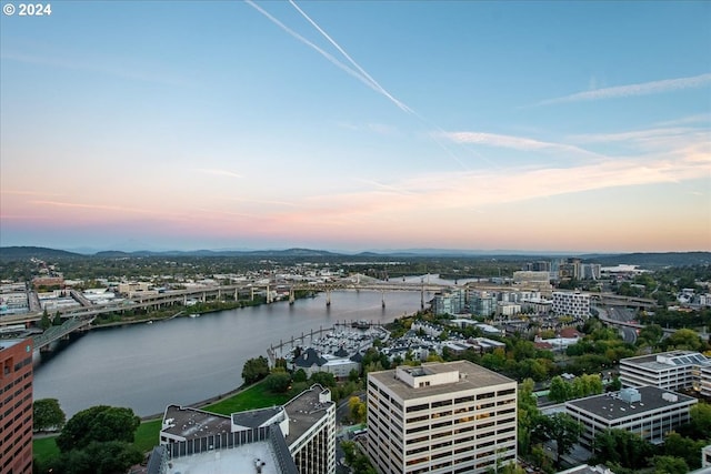 aerial view at dusk with a water view