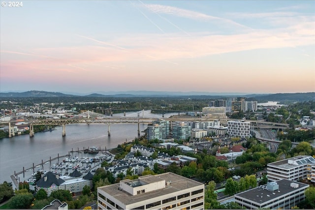 aerial view at dusk with a water view