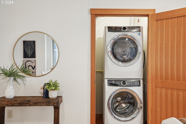 laundry area with stacked washer / drying machine