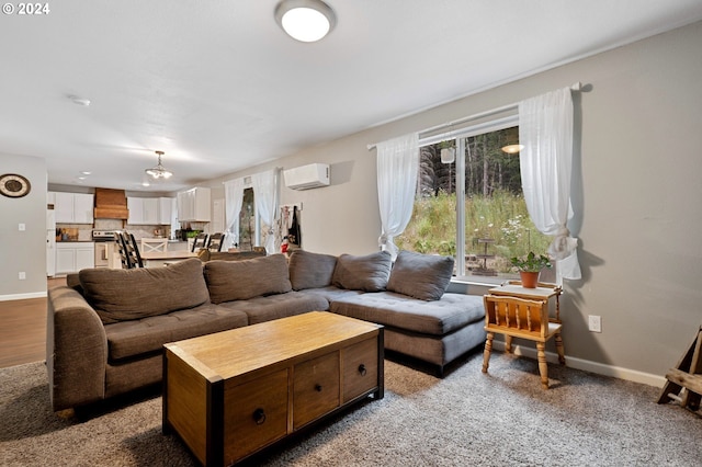 carpeted living room with a healthy amount of sunlight and a wall unit AC