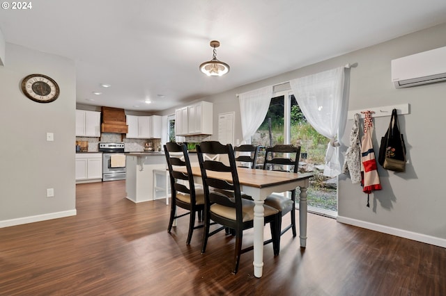 dining room with dark hardwood / wood-style flooring, a chandelier, and a wall mounted air conditioner