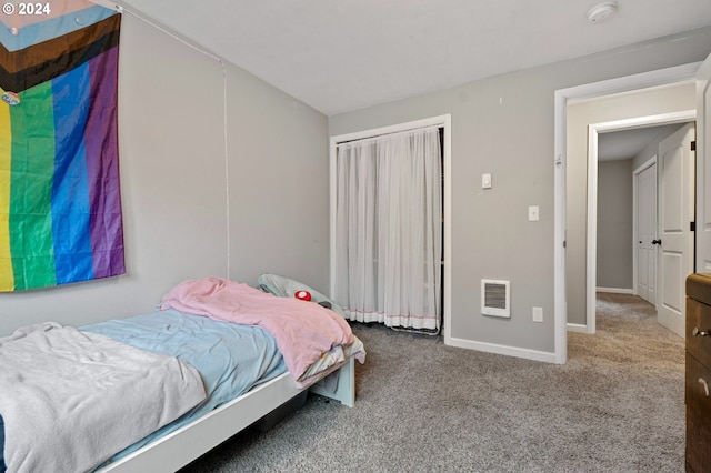 carpeted bedroom with heating unit