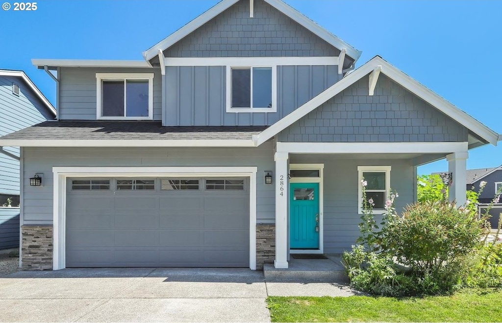 craftsman-style home with a garage