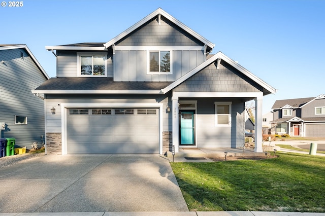 craftsman house featuring a garage, a front yard, and a porch