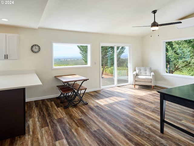 sitting room featuring ceiling fan and dark wood-type flooring